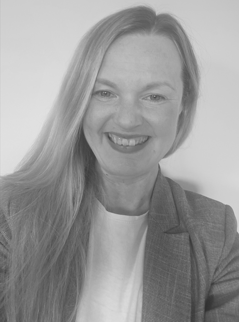 Headshot of Tamara Fitzpatrick. She’s wearing a white shirt and grey blazer.