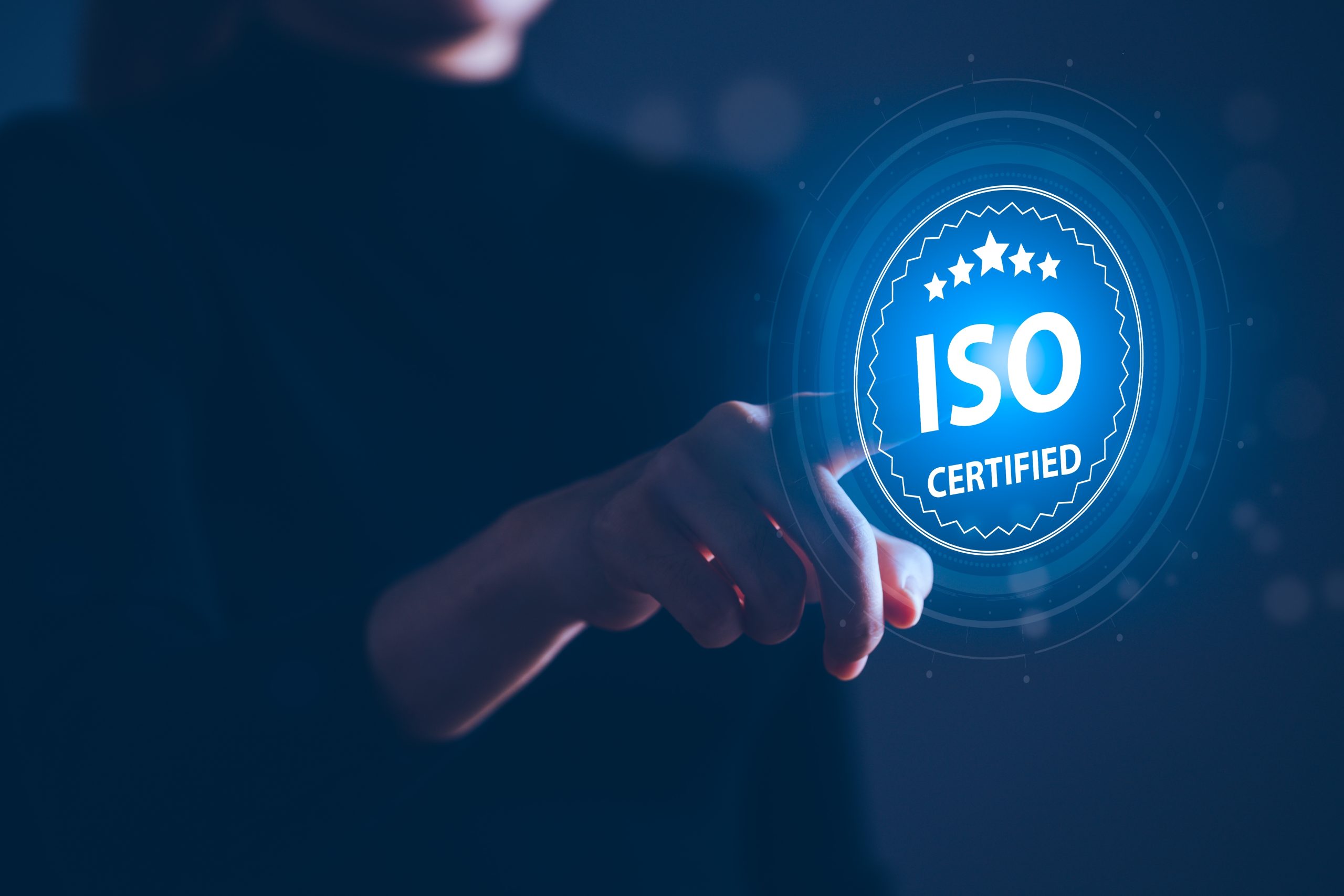 A finger presses a button that reads, 'ISO certified'.