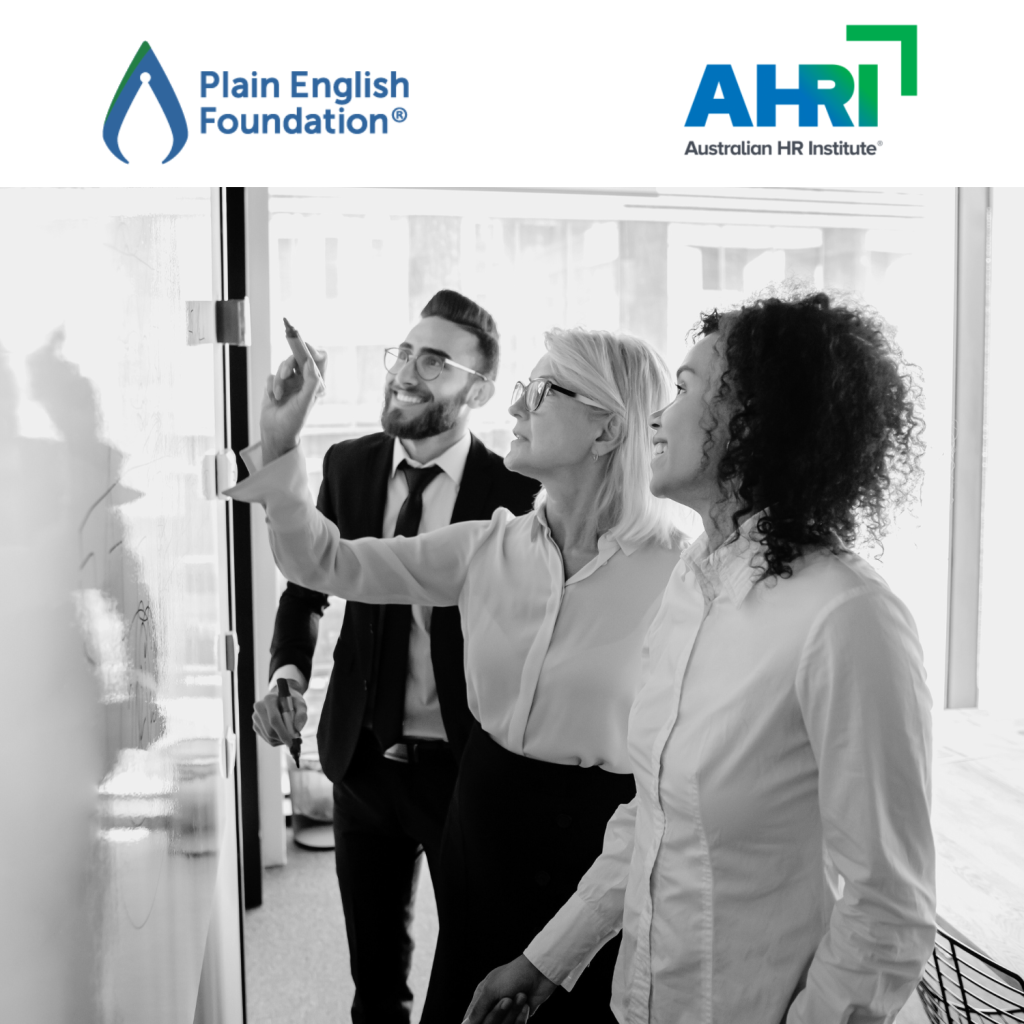Three professionals work together on a whiteboard. Above this image sit the Plain English Foundation and Australian Human Relations Institution logos.