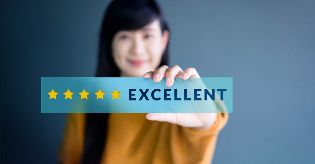 Woman holds up a 5-star excellent rating.